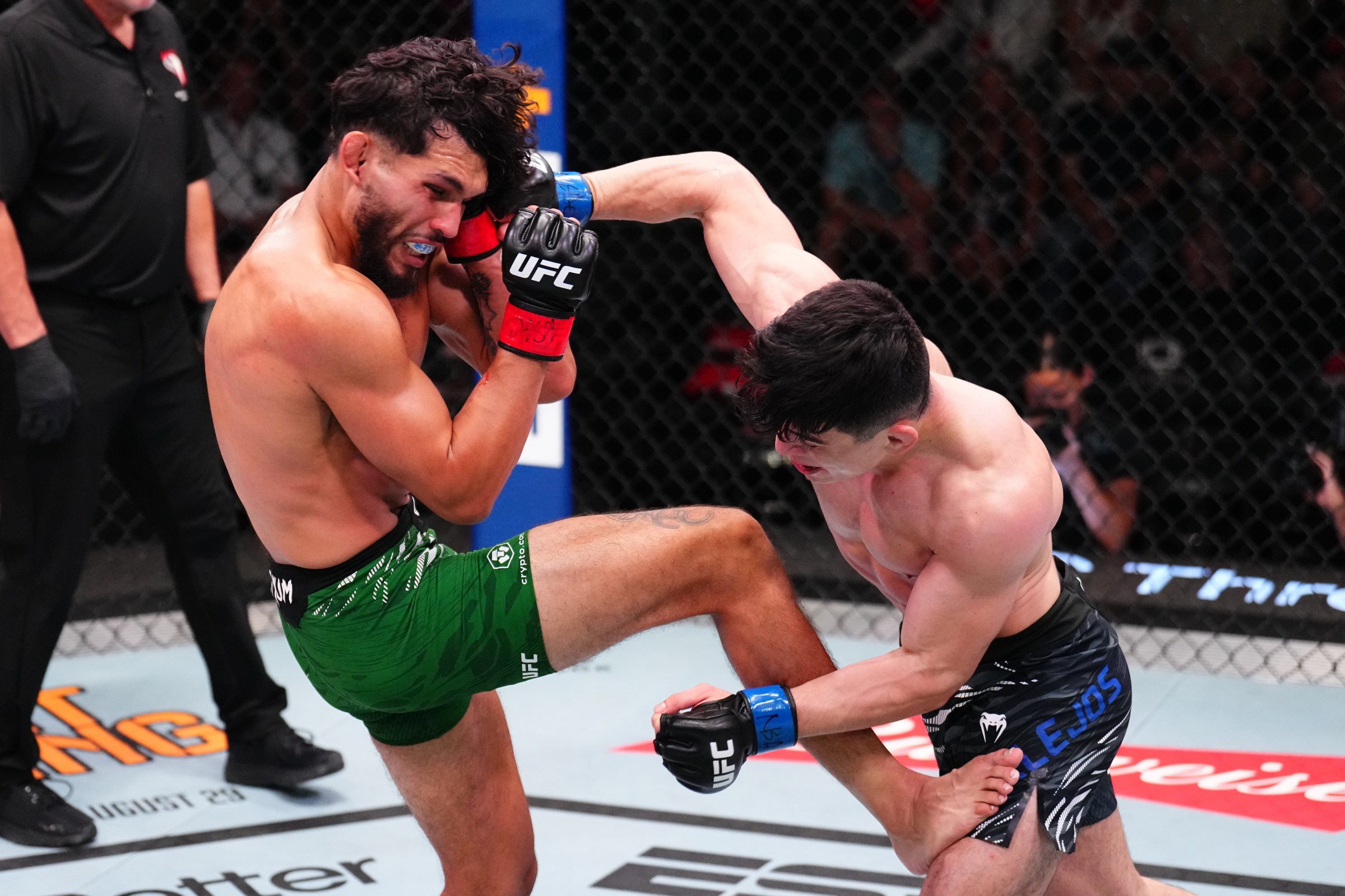 LAS VEGAS, NEVADA - AUGUST 02: (R-L) Kevin Vallejos of Argentina punches Danny Silva in a featherweight fight during the UFC Fight Night event at UFC APEX on August 02, 2025 in Las Vegas, Nevada. (Photo by Chris Unger/Zuffa LLC)