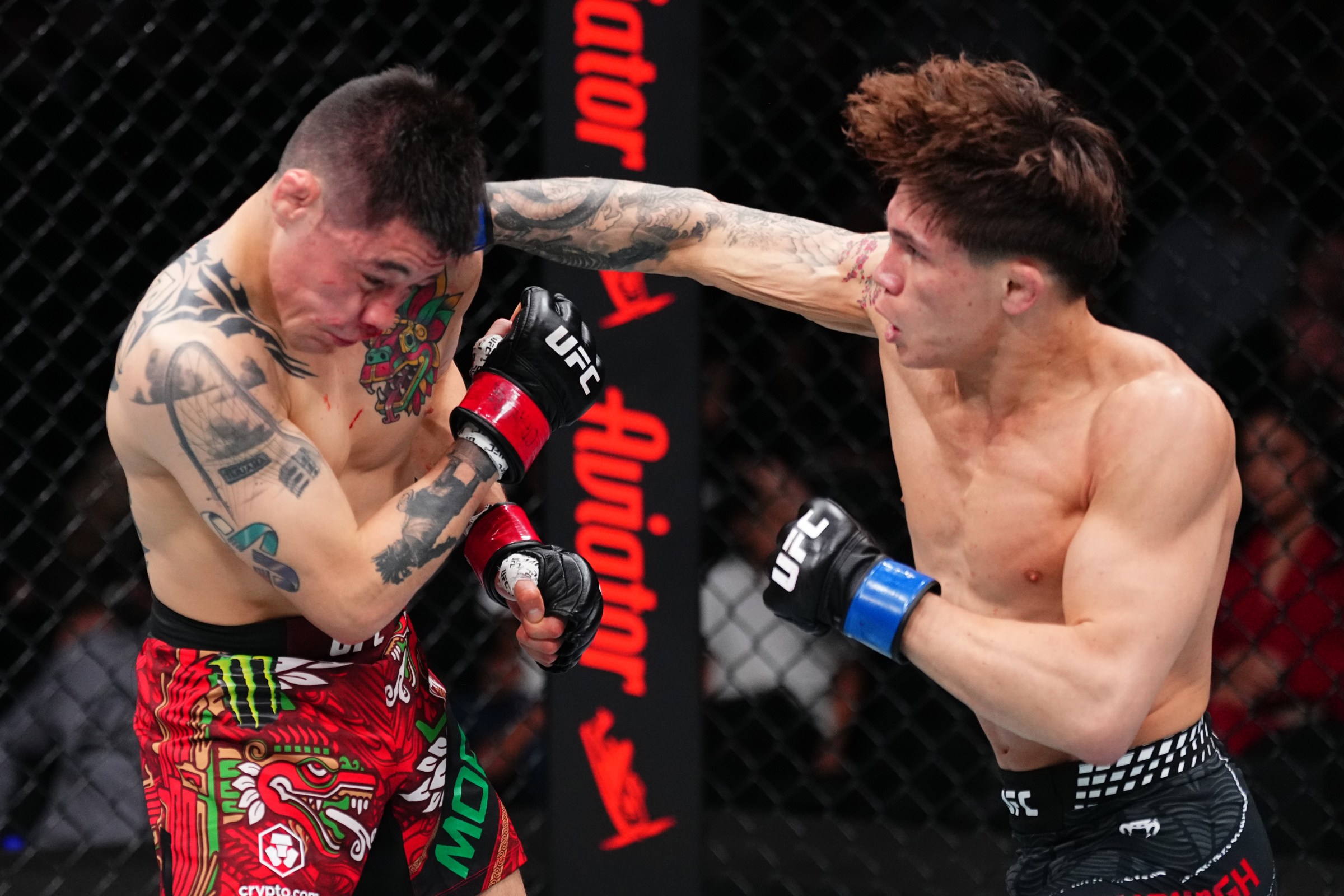 MEXICO CITY, MEXICO - FEBRUARY 28: (R-L) Lone’er Kavanagh of England punches Brandon Moreno of Mexico in a flyweight fight during the UFC Fight Night event at Arena CDMX on February 28, 2026 in Mexico City, Mexico. (Photo by Jeff Bottari/Zuffa LLC)