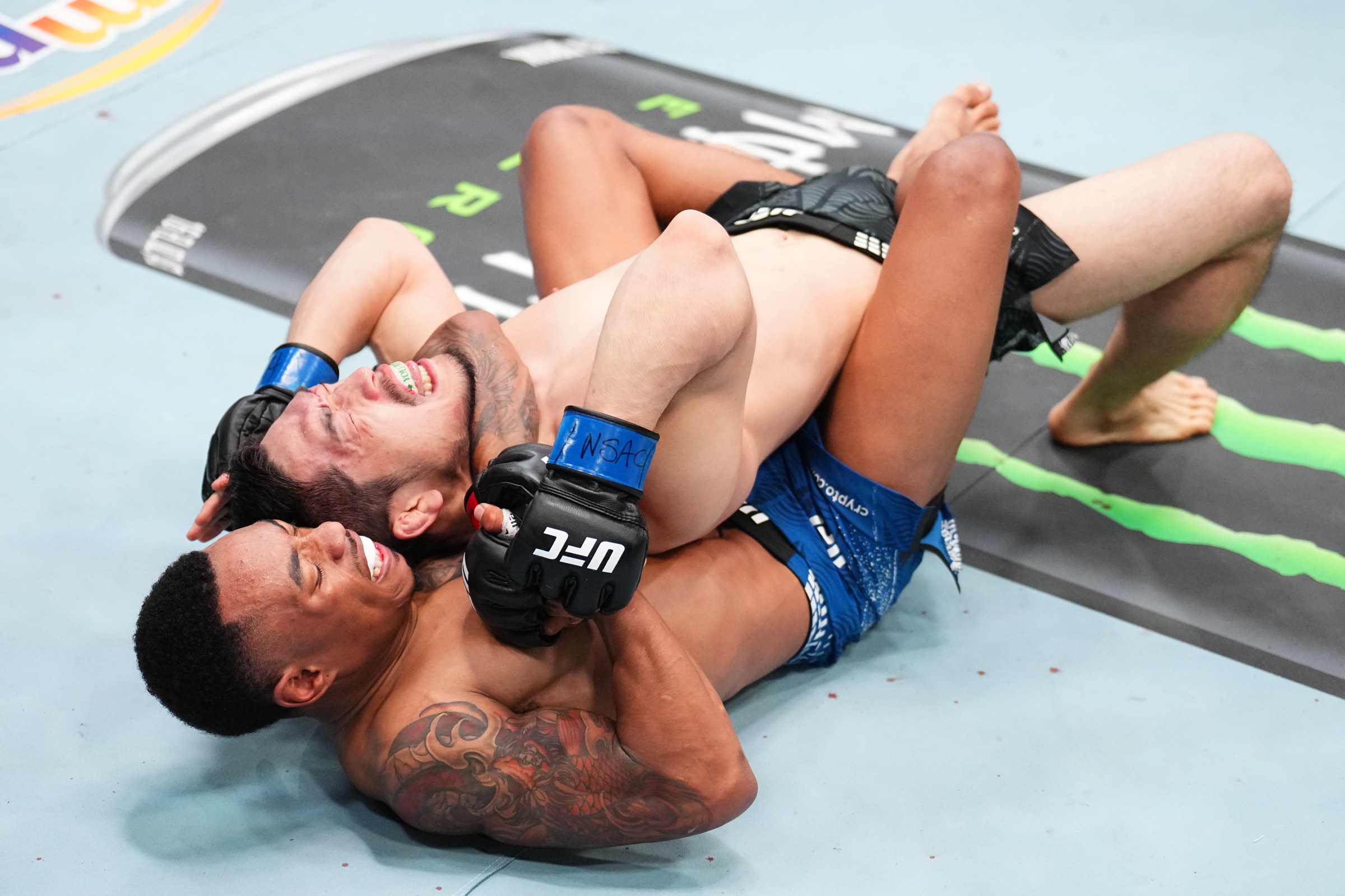 LAS VEGAS, NEVADA - MARCH 14: (L-R) Elijah Smith secures a rear choke submission against SuYoung You of South Korea in a bantamweight fight during the UFC Fight Night event at Meta APEX on March 14, 2026 in Las Vegas, Nevada. (Photo by Chris Unger/Zuffa LLC)