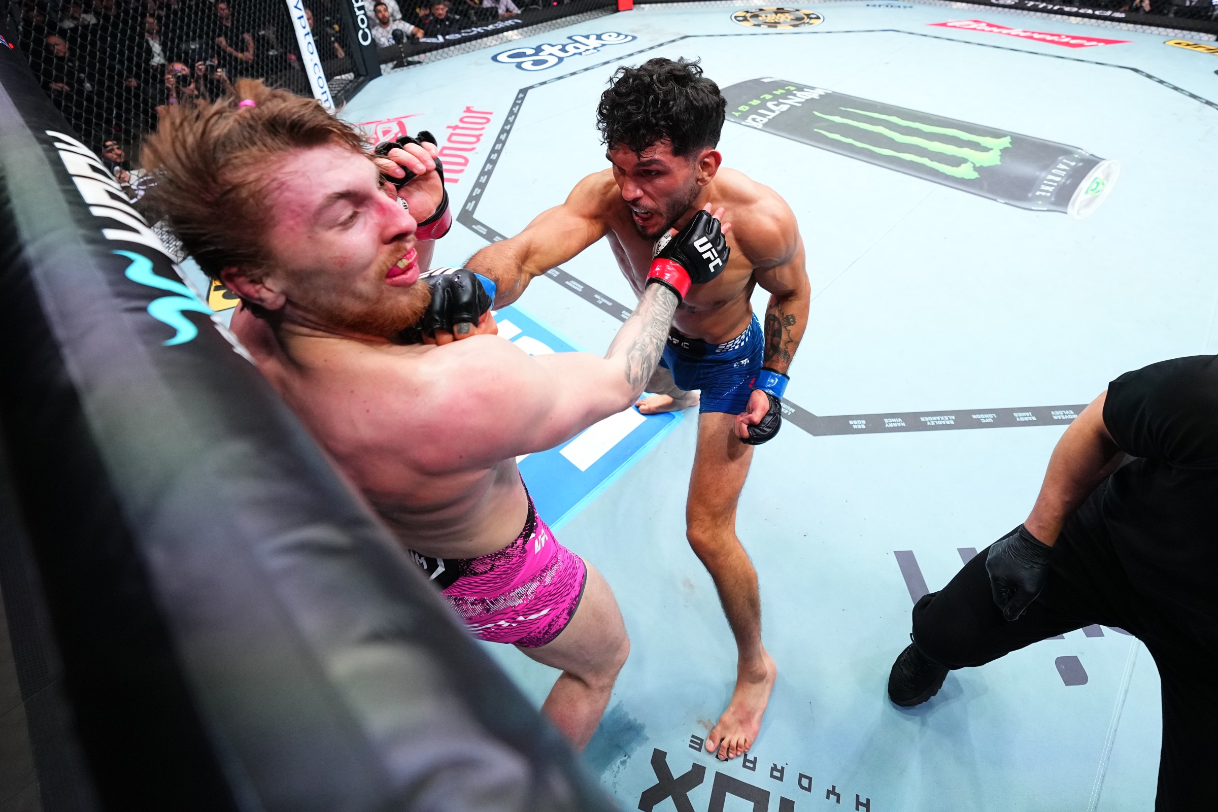 LONDON, ENGLAND - MARCH 21: (R-L) Danny Silva punches Kurtis Campbell of England in a featherweight fight during the UFC Fight Night event at The O2 on March 21, 2026 in London, England. (Photo by Chris Unger/Zuffa LLC)