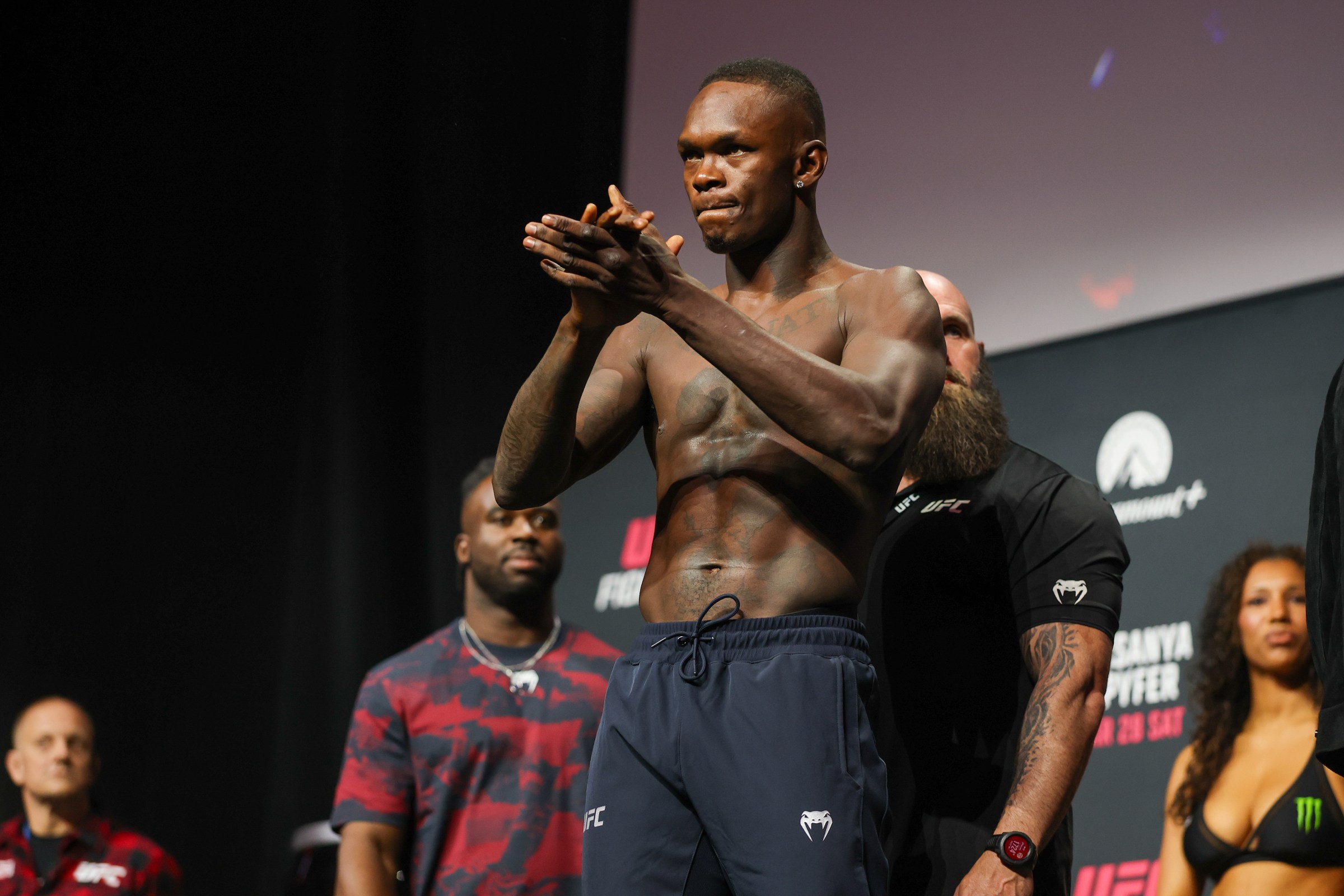 SEATTLE, WASHINGTON - MARCH 27: UFC middleweight fighter Israel Adesanya poses on the scale onstage during UFC Fight Night: Adesanya v Pyfer ceremonial Weigh-in at Climate Pledge Arena on March 27, 2026 in Seattle, Washington. (Photo by Mat Hayward/Getty Images)