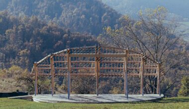 reversible timber structure follows the arc of the setting sun in italy