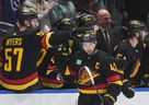 Vancouver Canucks defenceman Quinn Hughes celebrates his goal against the San Jose Sharks with teammate Tyler Myers during Nov. 20, 2023 game at Rogers Arena. They were both traded this NHL season.