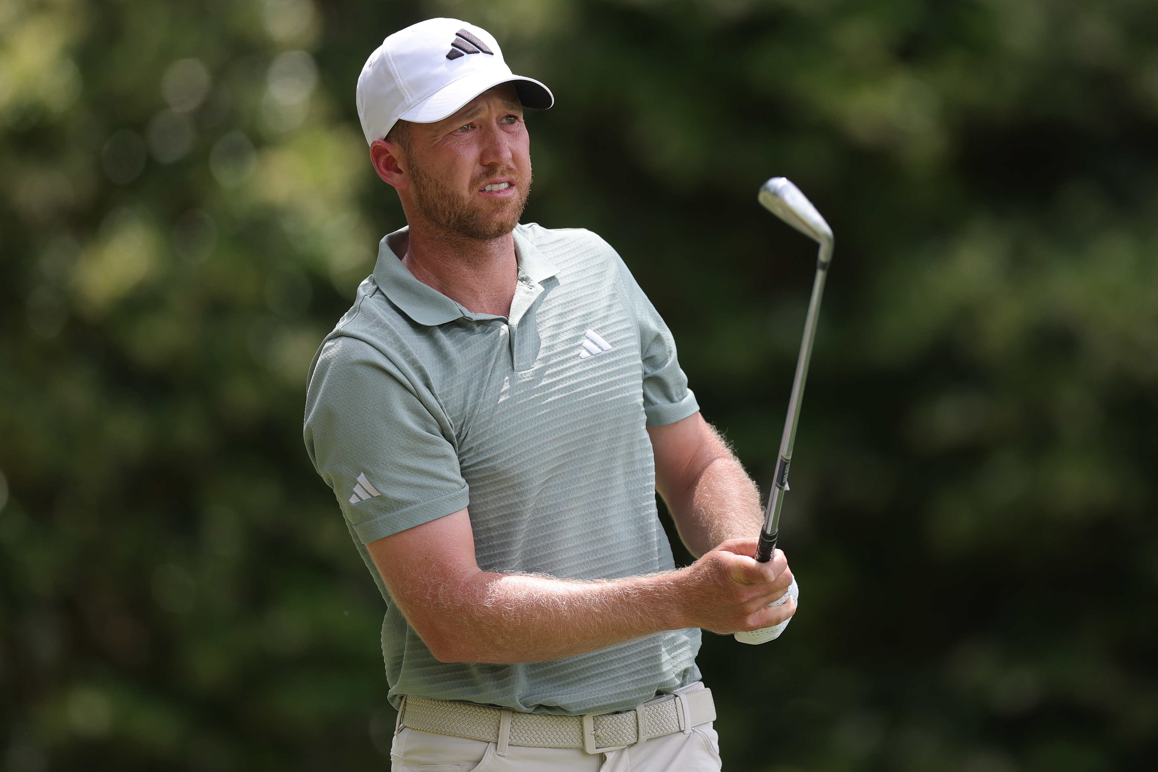 Daniel Berger watches a golf shot