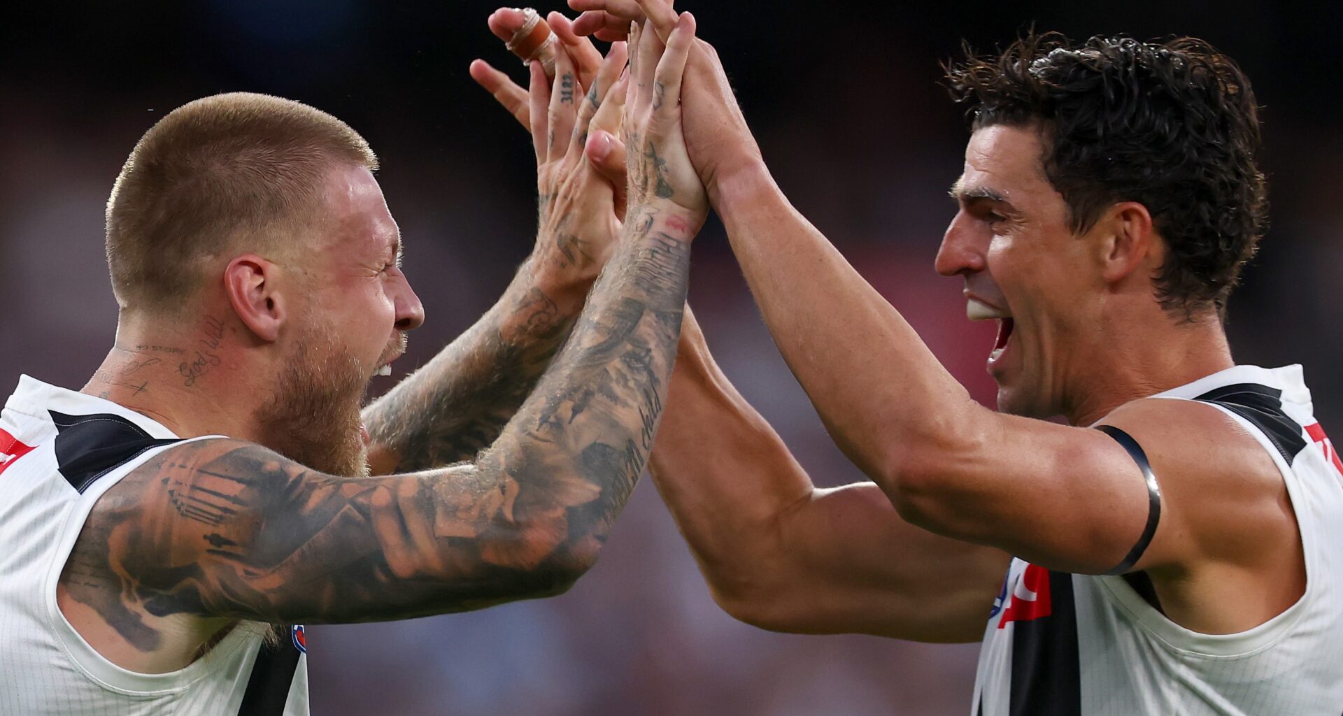Magpies hold firm as surging Saints fall short in fiery MCG showdown