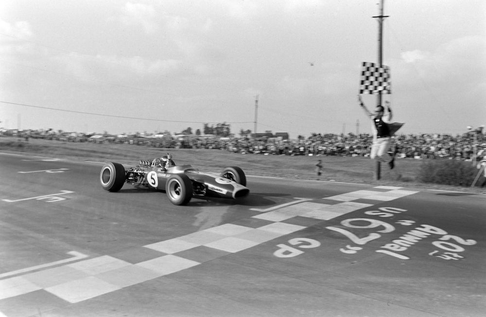  Jim Clark raises his thumb as he wins the 1967 US Grand Prix with an ailing Lotus 49. His right-rear wheel is all but hanging on after a suspension failure.