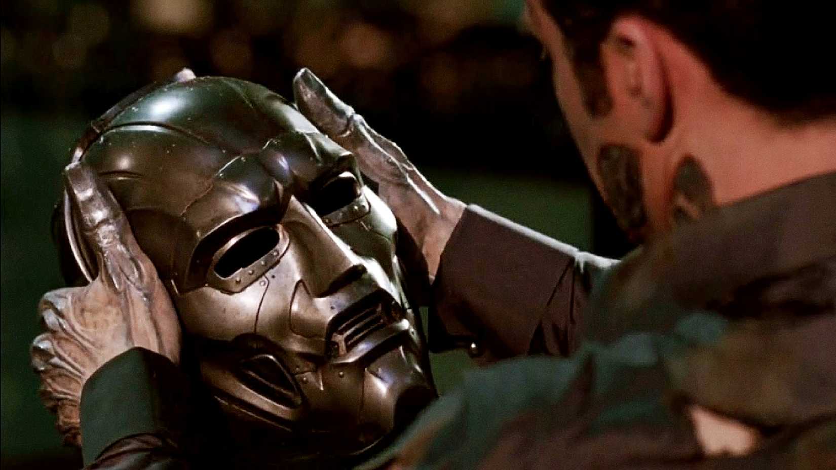 Julian McMahon's Doctor Doom looks at his mask in 2005's Fantastic Four