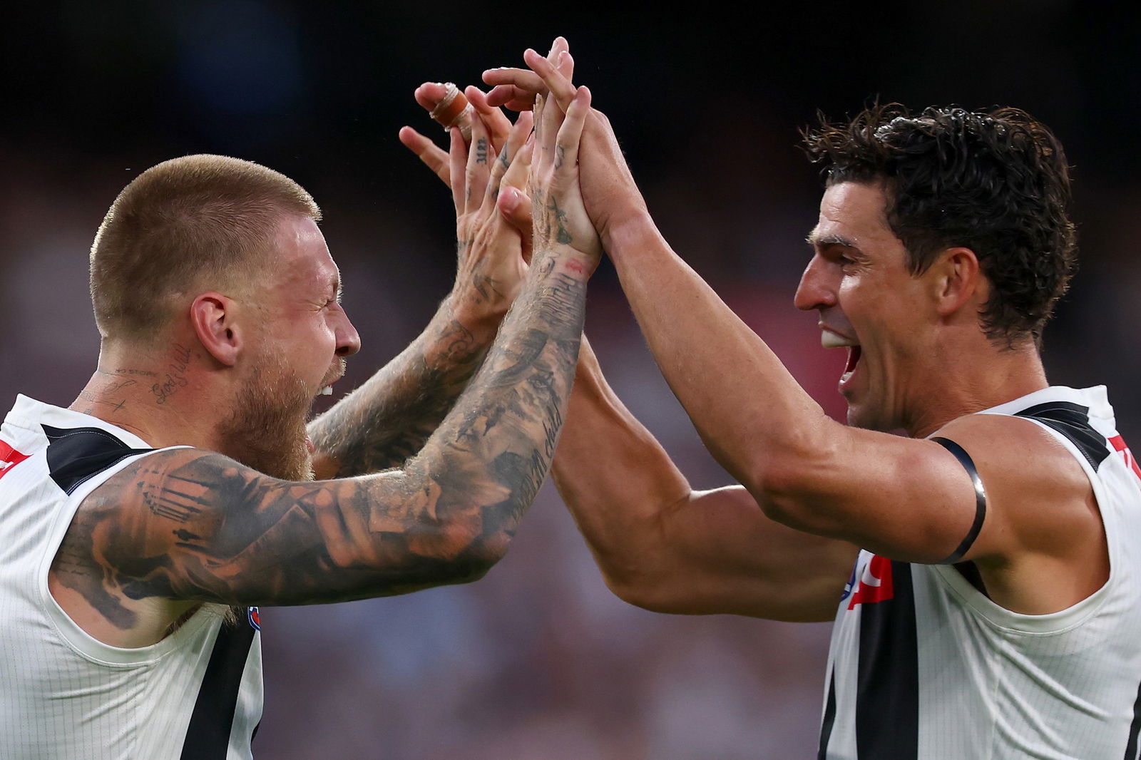  Jordan De Goey of the Magpies celebrates with Scott Pendlebury of the Magpies after kicking a goal during the AFL Opening Round match between St Kilda Saints and Collingwood Magpies at Melbourne Cricket Ground, on March 08, 2026, in Melbourne, Australia.