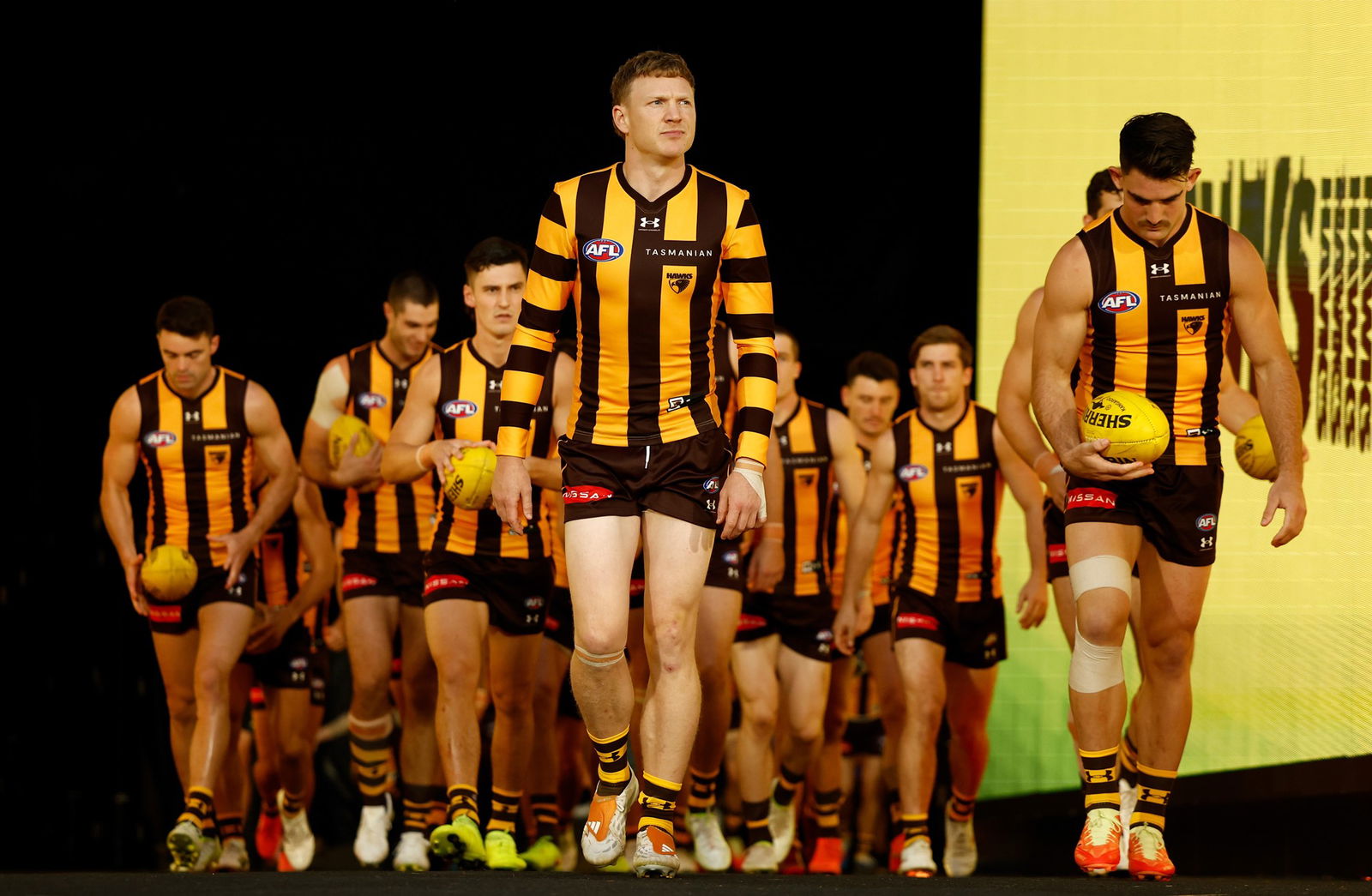 James Sicily of the Hawks leads out his team during the 2026 AFL Round 02 match between the Hawthorn Hawks and the Sydney Swans at the Melbourne Cricket Ground on March 19, 2026 in Melbourne, Australia.
