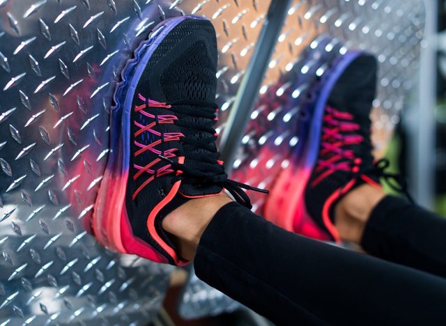 Leg Press Woman doing leg presses in bright sneakers