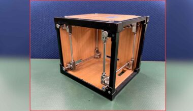 LignoSat wooden cube satellite prototype with metal supports, illustrating Japan’s experiment to reduce orbital debris with wood.