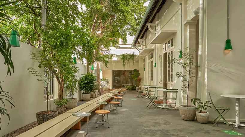 century-old courtyard villa in vietnam revives as matte teabar flagship - 3
