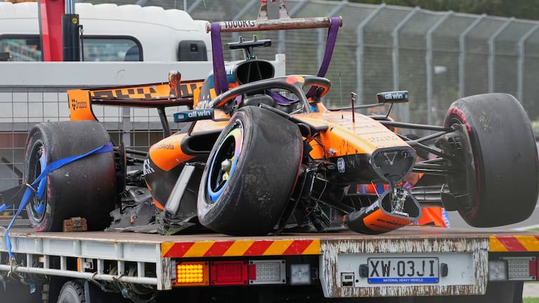 McLaren driver Oscar Piastri of Australia's car is taken from the track track after he crashed during the formation lap ahead of the Australian Formula One Grand Prix at Albert Park, in Melbourne, Australia