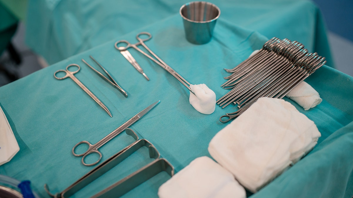 High angle view of various surgical equipment on a tray inside the operating room at a hospital. Preparation for surgery.