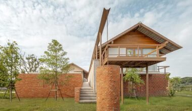 brick and concrete sculpt elevated river residence by bodinchapa