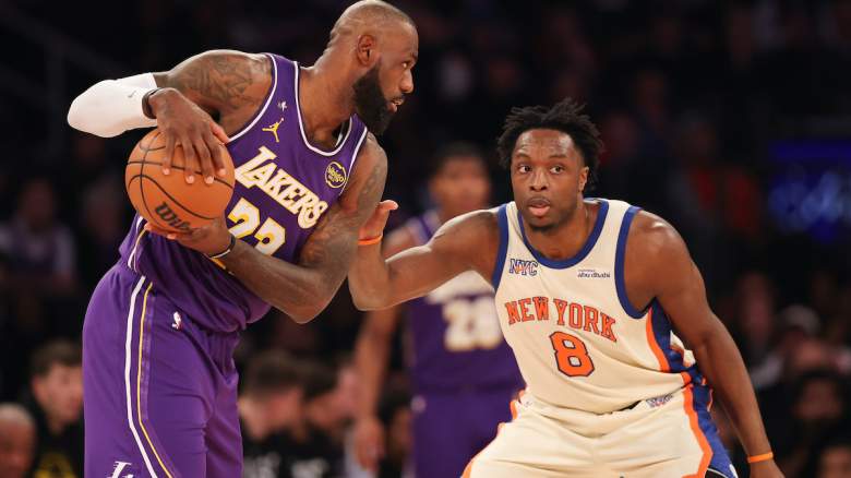 Lebron James of the Lakers looks to drive on O.G. Anunoby of the Knicks.