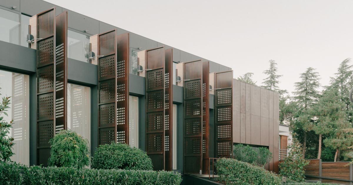 punctured iron doors shape kinetic facade by TIMM architecture