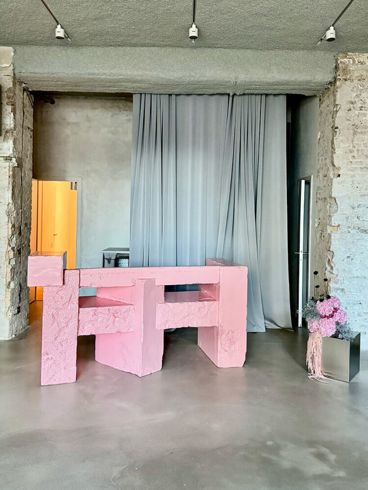 the booth adds a pop of color in the space