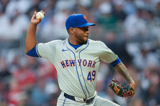 FILE - New York Mets pitcher Julio Teheran delivers to an Atlanta Braves batter in the first inning of a baseball game Monday, April 8, 2024, in Atlanta. (AP Photo/John Bazemore, File)
