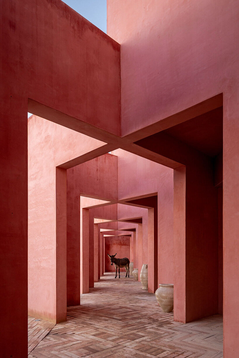red-toned stucco surfaces form layered facade for boutique hotel by RA! in mexico - 4