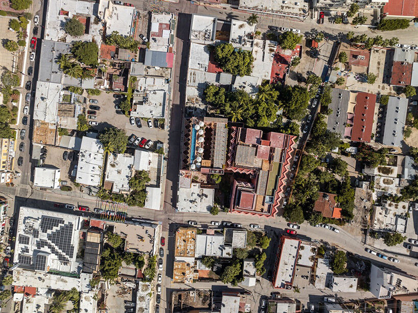 red-toned stucco surfaces form layered facade for boutique hotel by RA! in mexico - 10
