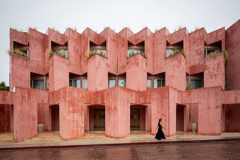 red-toned stucco surfaces form layered facade for boutique hotel by RA! in mexico - 1