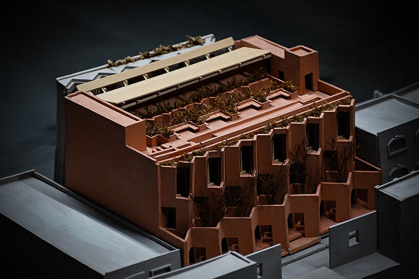 the model highlights the layered facade and planted terraces across upper levels 