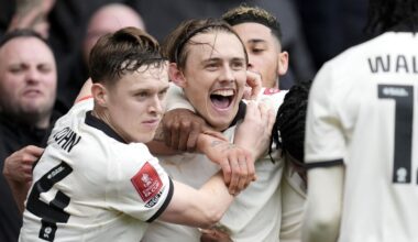 Ben Waine is mobbed by his team-mates after heading Port Vale in front against Sunderland