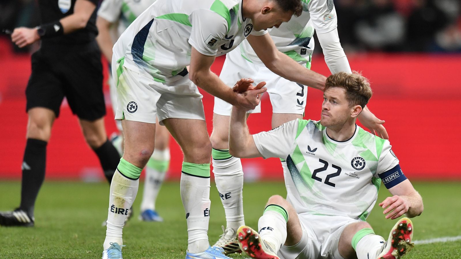 Ireland's Dara O'Shea helps Nathan Collins up