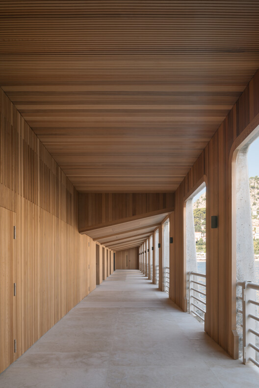 Transforming a Concrete Shell into a Wooden Interior Shaped by the Sea - Image 9 of 15