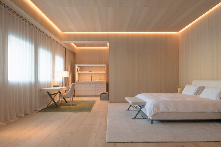 Transforming a Concrete Shell into a Wooden Interior Shaped by the Sea - Image 12 of 15