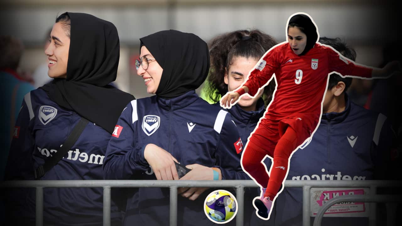 An image of three girls wearing soccer jerseys and headscarves in the background, in the foreground is a woman in all red kicking a soccer ball.