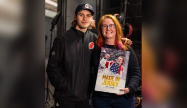 Hughes meets photographer who snapped iconic Olympic photo