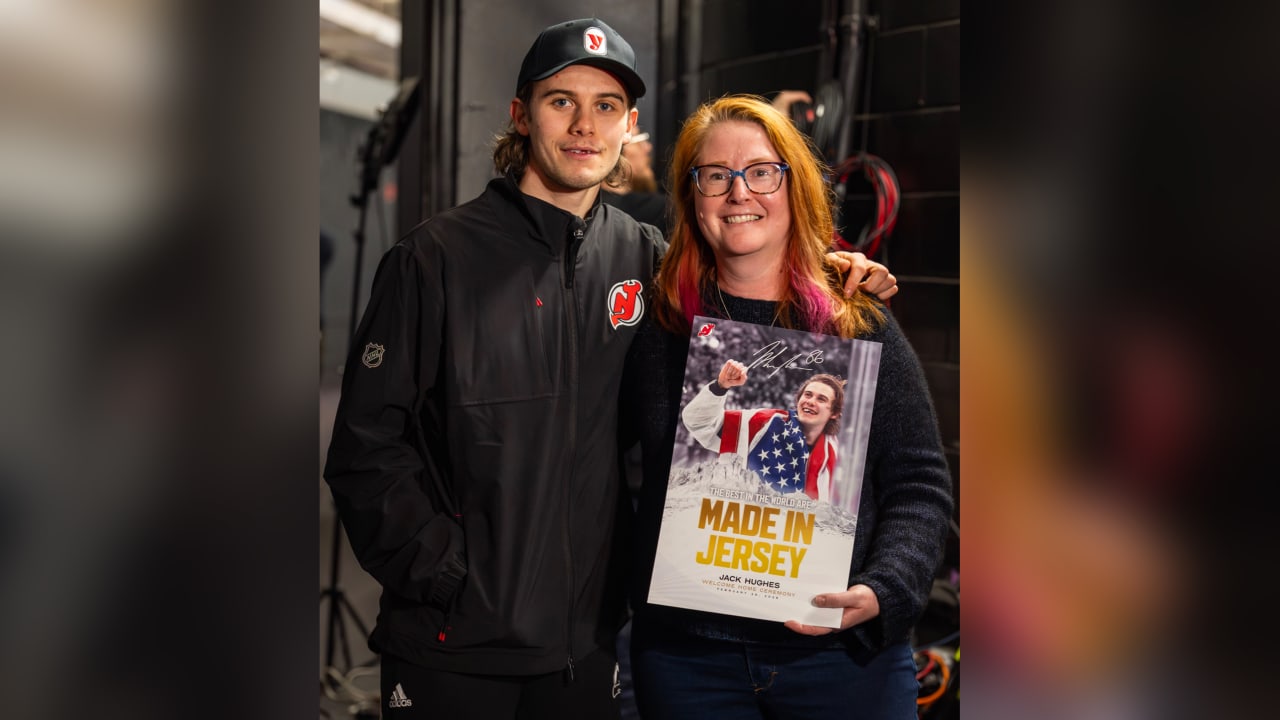 Hughes meets photographer who snapped iconic Olympic photo