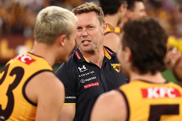 Hawthorn coach Sam Mitchell addressing Ginnivan and his teammates including Nick Watson.