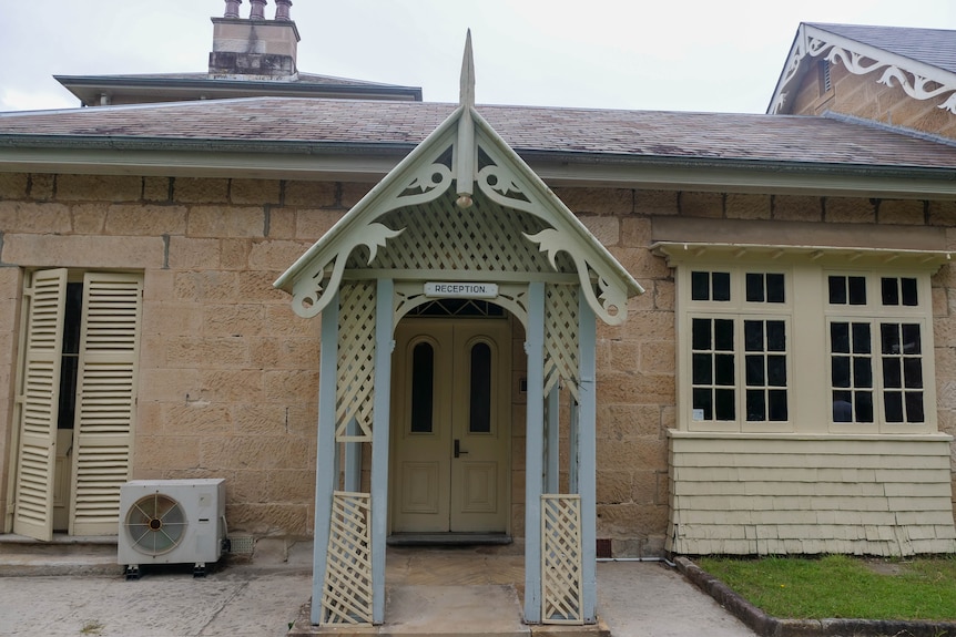 an arched doorway on a sandstone building