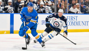 Apr 9, 2026; St. Louis, Missouri, USA; St. Louis Blues defenseman Philip Broberg (6) controls the puck as Winnipeg Jets left wing Cole Koepke (45) defends during the second period at Enterprise Center. Mandatory Credit: Jeff Curry-Imagn Images