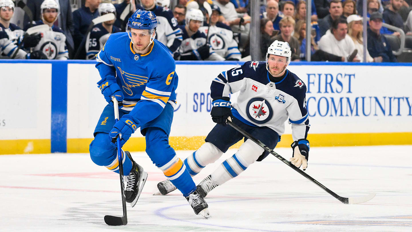 Apr 9, 2026; St. Louis, Missouri, USA; St. Louis Blues defenseman Philip Broberg (6) controls the puck as Winnipeg Jets left wing Cole Koepke (45) defends during the second period at Enterprise Center. Mandatory Credit: Jeff Curry-Imagn Images