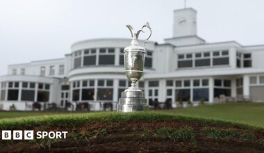 The Claret Jug photographed on top of a bunker in front of the Royal Birkdale clubhouse