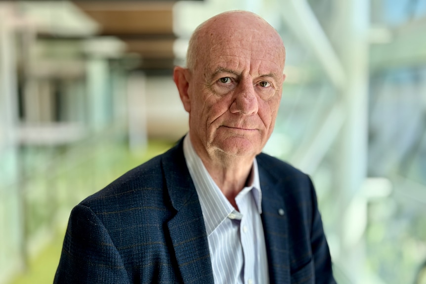 Tim Costello wearing a suit.