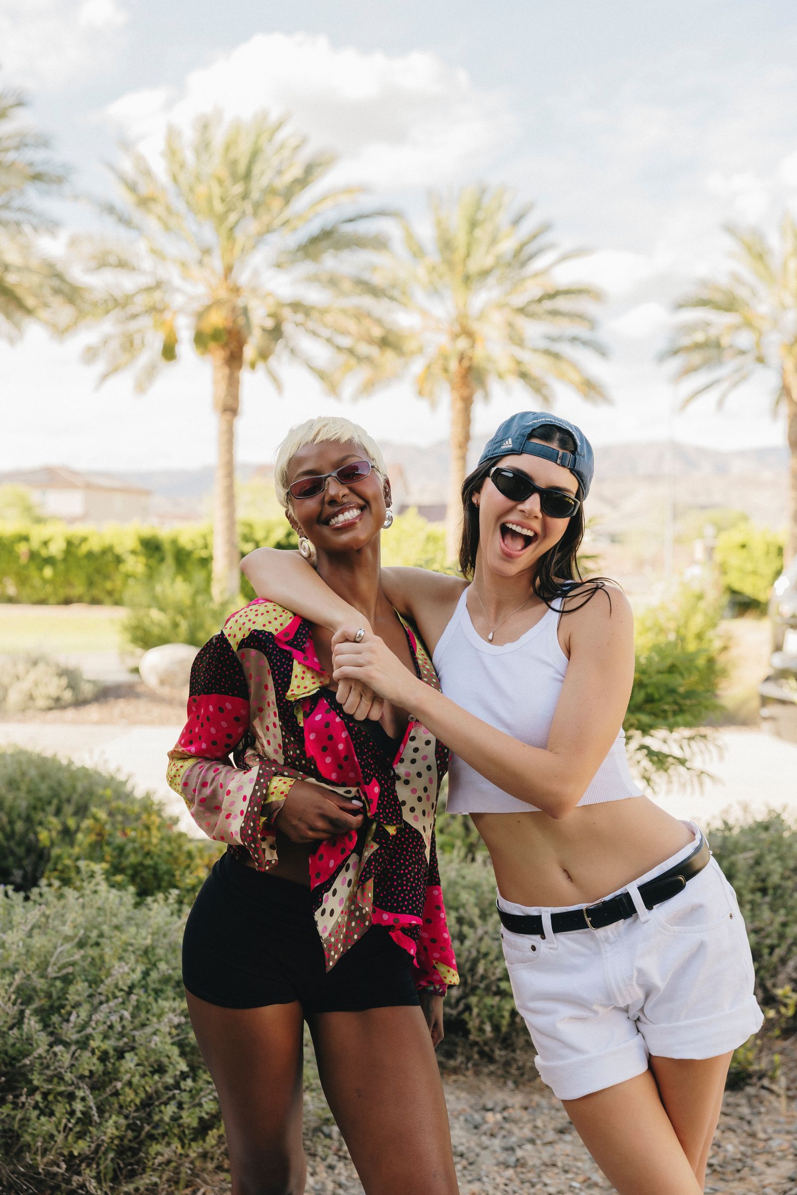 Image may contain Kendall Jenner Justine Skye Adult Person Head Face Blouse Clothing Happy Laughing and People