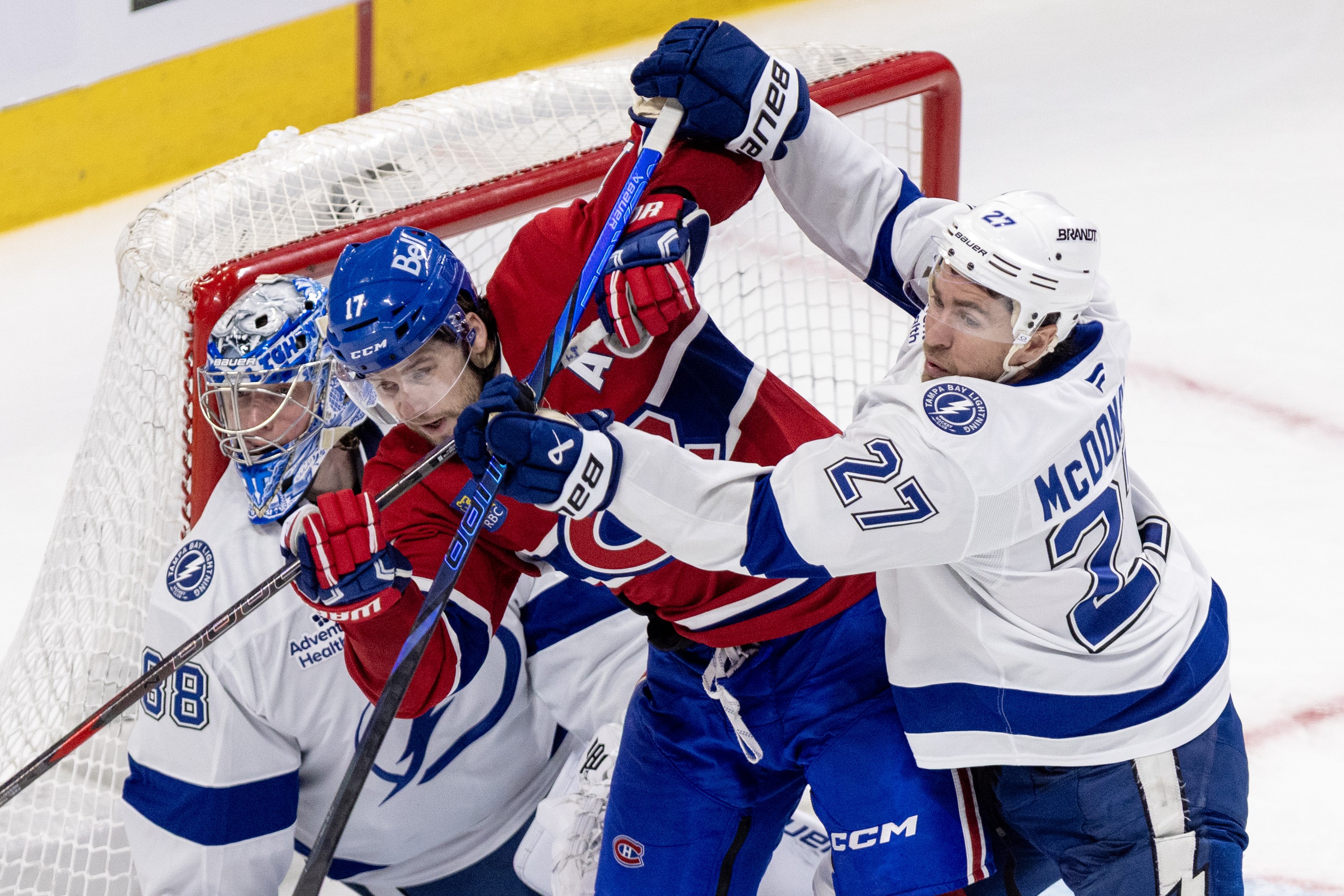 Canadiens' Josh Anderson battles with Lightning's Ryan McDonagh in front of goalie Andrei Vasilevsliy.