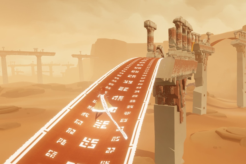 A cloaked figure moves across a long strip of fabric in the desert between ruined columns.