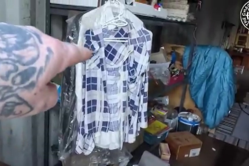 A messy living quarters inside a shipping container