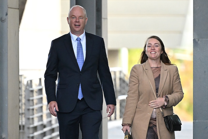 Simon Patterson, dressed in a suit, pictured walking beside Jessica O'Donnell
