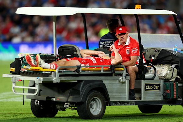 Kyle Flanagan is taken from the field after being knocked out against the Titans.