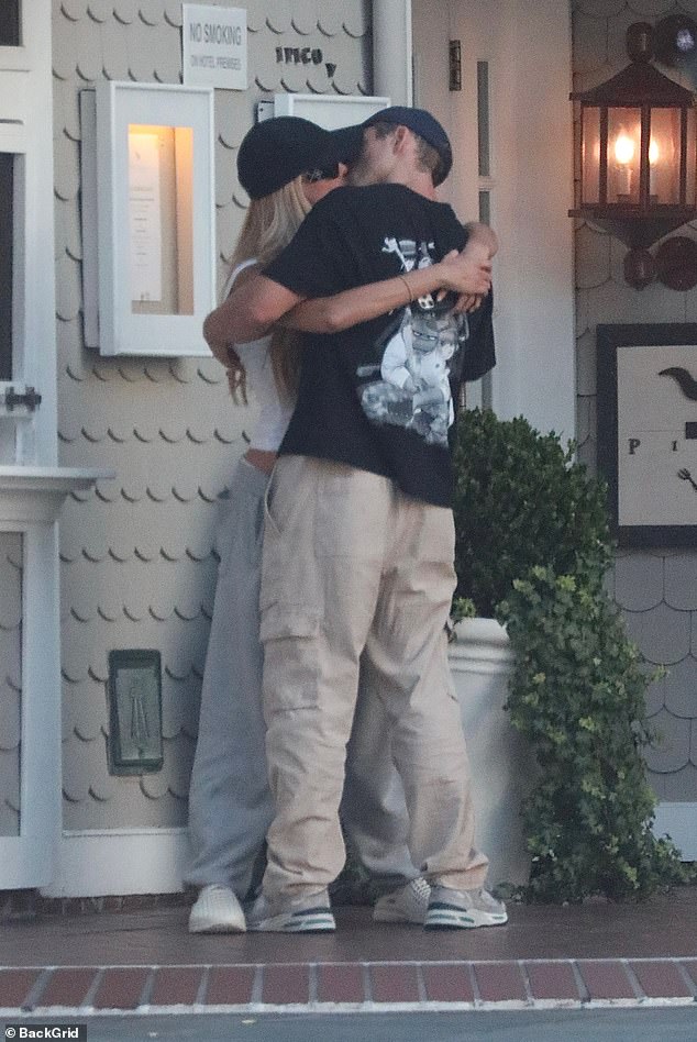 The 29-year-old model devoured her new love Taron Egerton during a public make out session in Santa Monica on Sunday