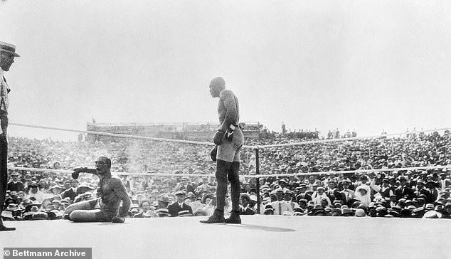 Jack Johnson (right) knocks out James Jeffries in Reno, Nevada