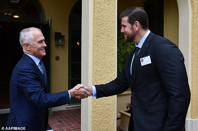 On the night which spelled the end of Roberts-Smith's affair with Person 17, he was guest of honour at a reception with then prime minister Malcolm Turnbull before she fell down the stairs. Above the two men in Canberra in 2017
