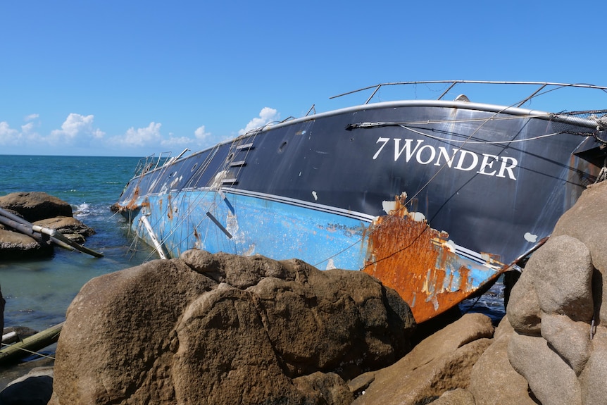 A big boat washed up on rocks